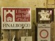 Continua la querelle degli adesivi a Finalborgo: ripulito il cartellone di Porta Reale