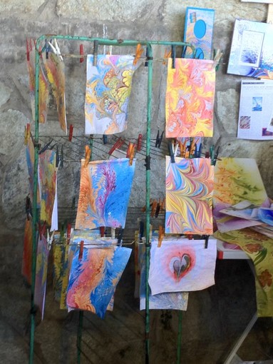 Premiata a Montecarlo l'artista savonese che dipinge sull'acqua